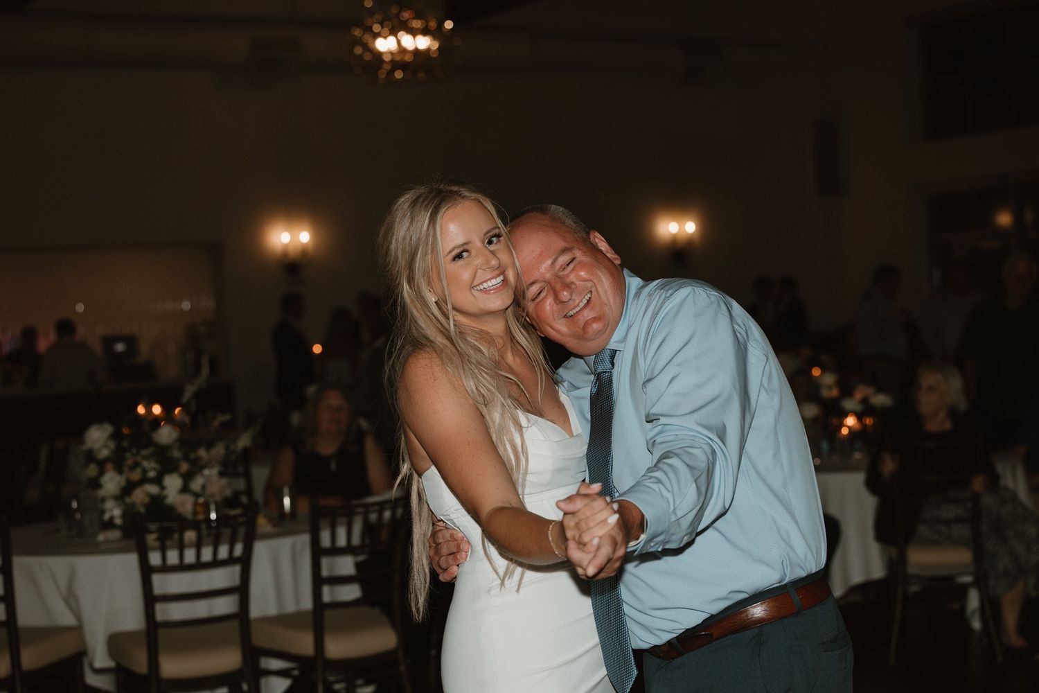 Bride and her father share a dance at elegant wedding reception venue.