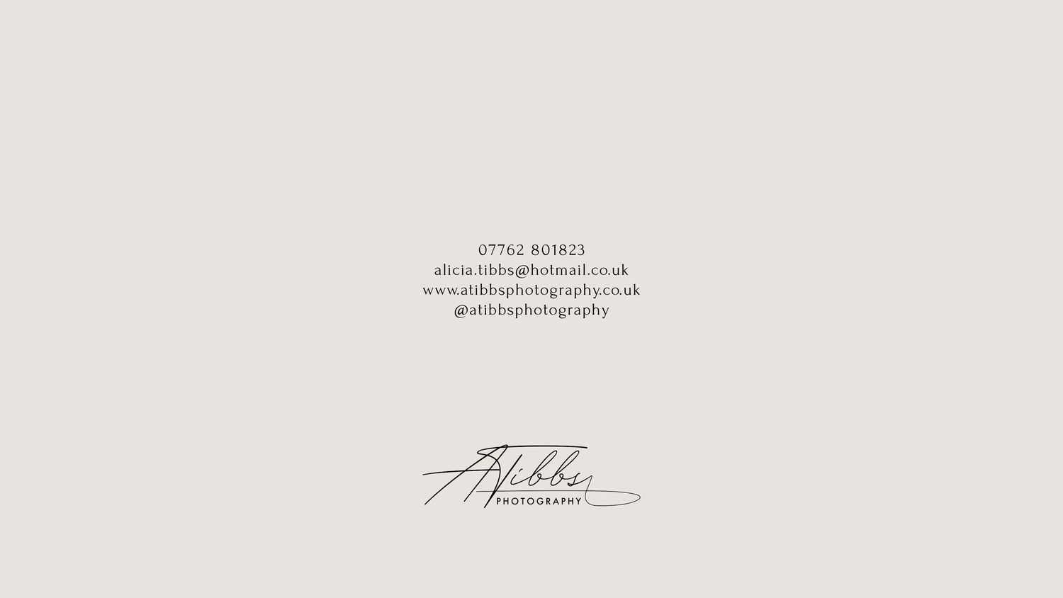 A handwritten signature in black ink appears on a white paper document.