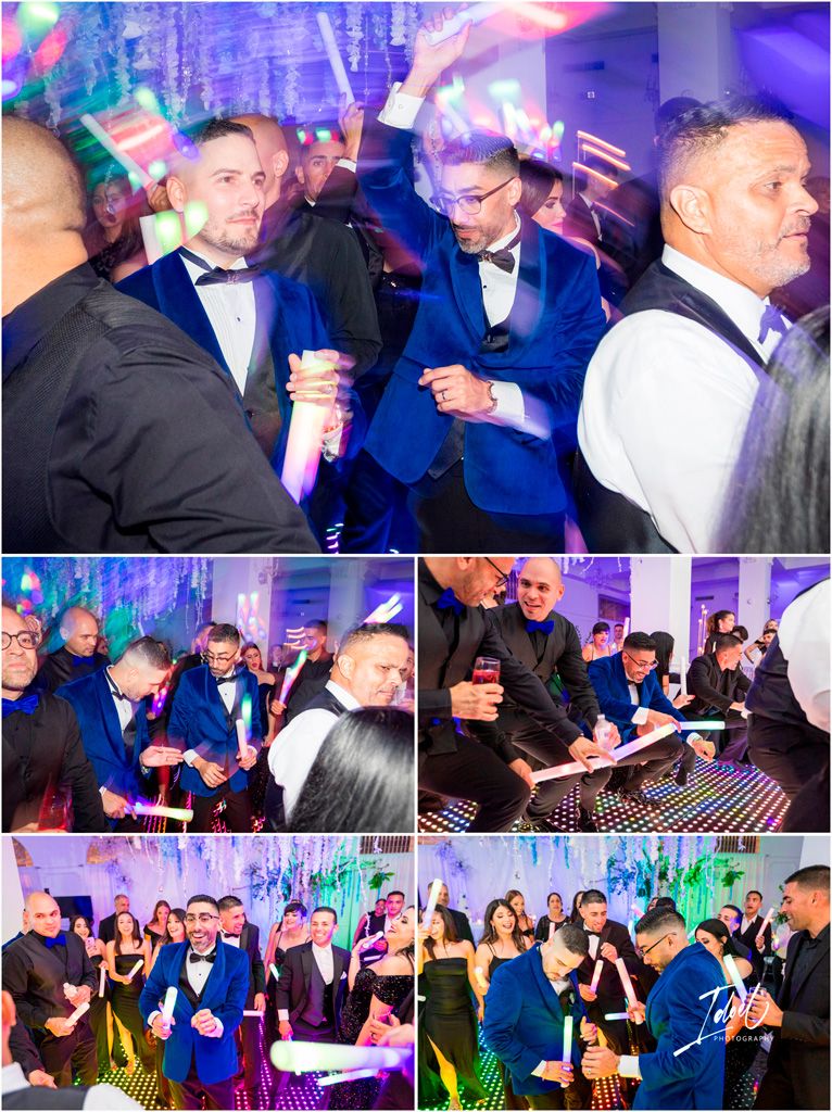 A festive celebration at an elegant party with people in formal attire dancing and socializing under colorful purple lighting.