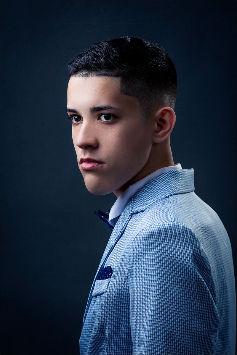 Portrait series of a person in a blue checkered dress shirt against a dark background showing different angles and poses.