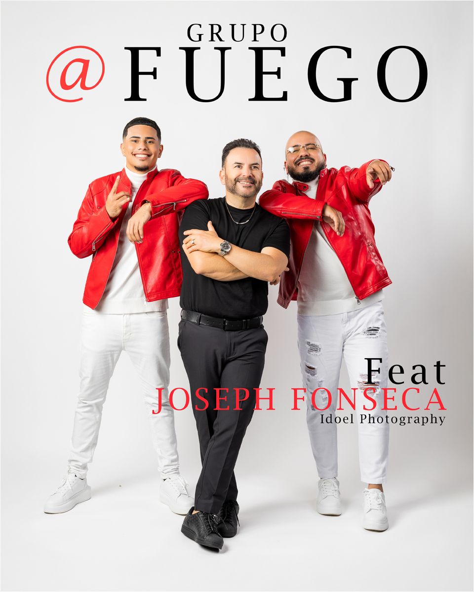 Music group members in red jackets and white pants pose together against white background for promotional photo.