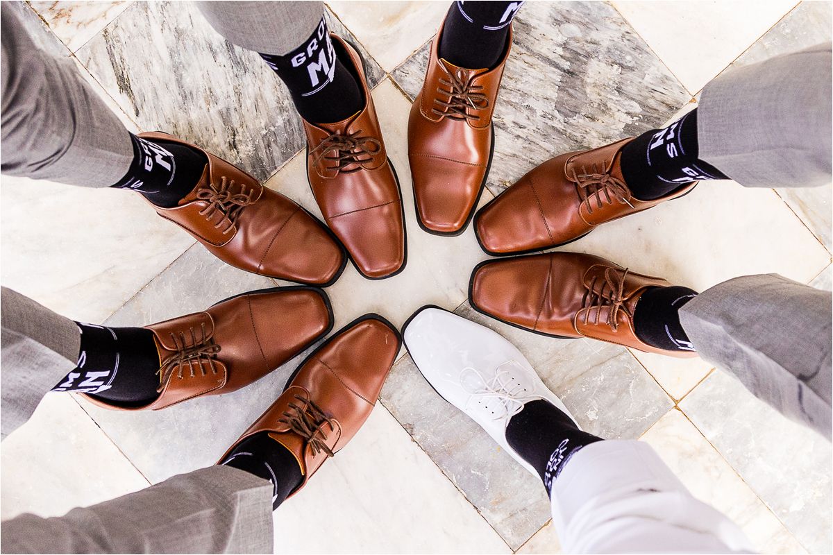 A series of photos showing brown leather oxford dress shoes paired with dark socks against a light colored background.