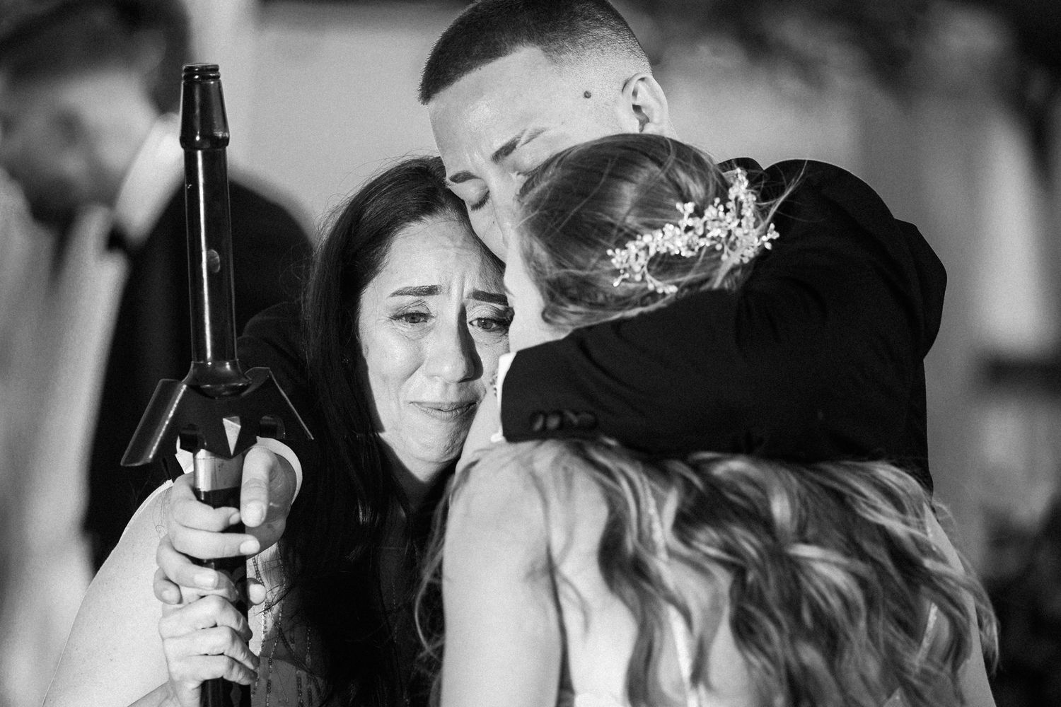 Black and white wedding portrait series showing emotional moments.