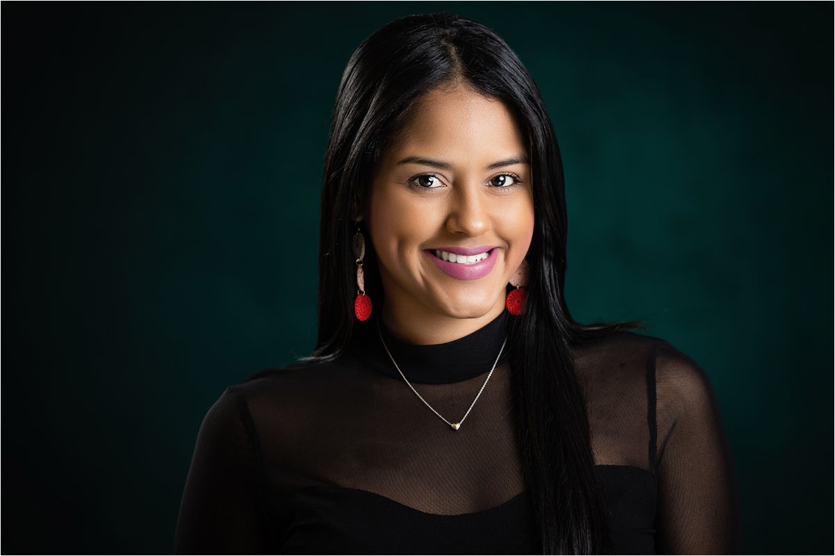 Professional headshot series with dark teal background showing confident smile and elegant business attire.