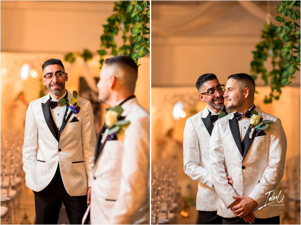 Two people in white tuxedo jackets share intimate moments at an elegant wedding reception with warm lighting.