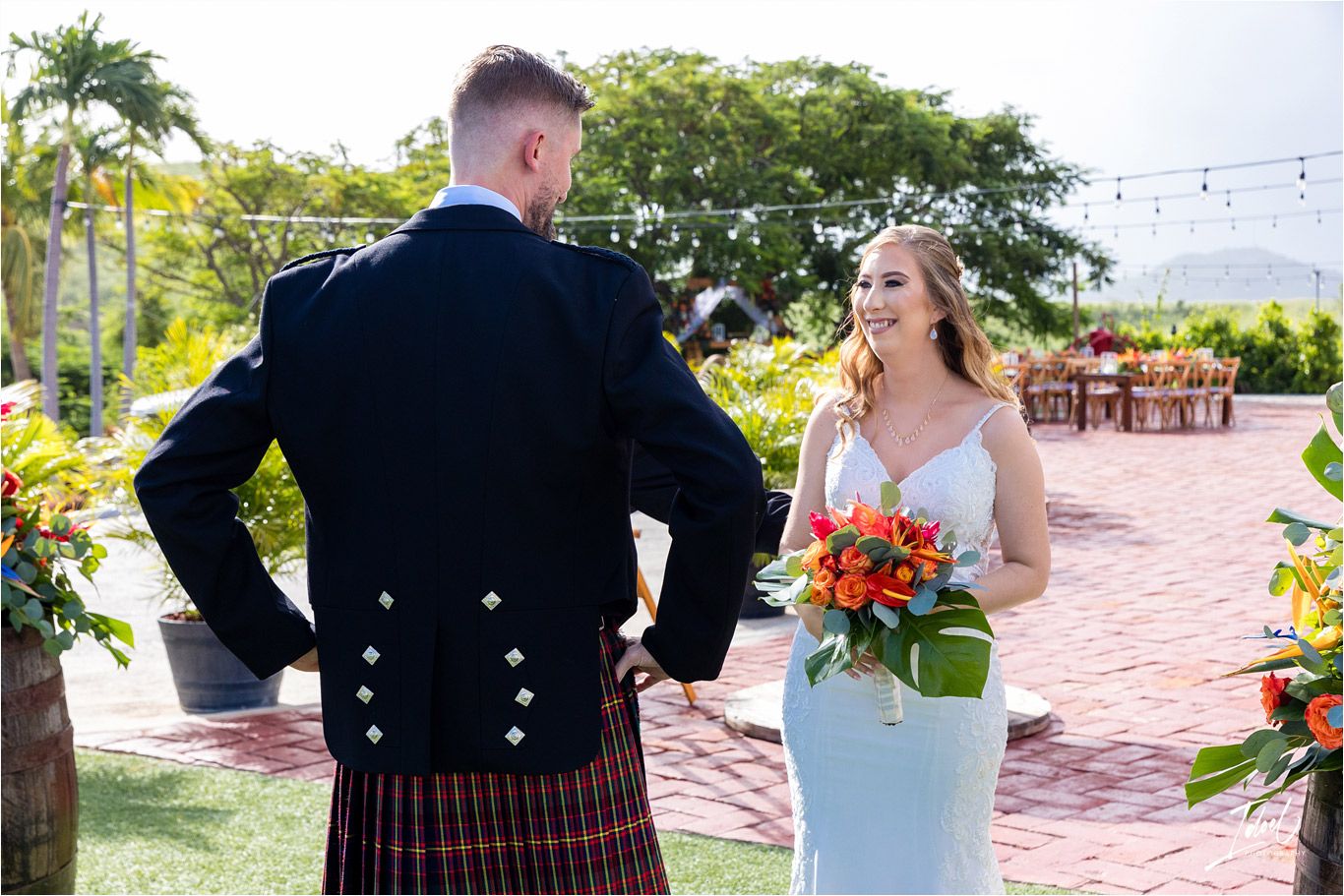 Traditional Scottish and modern wedding attire blend at an outdoor ceremony venue.