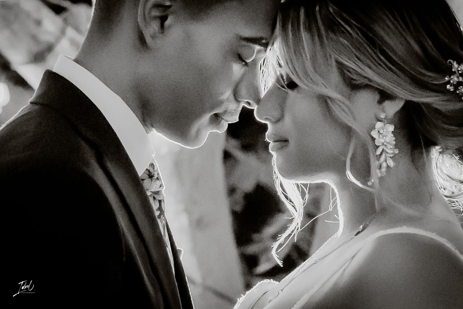 A romantic black and white wedding photo series showing intimate moments between a bride and groom.