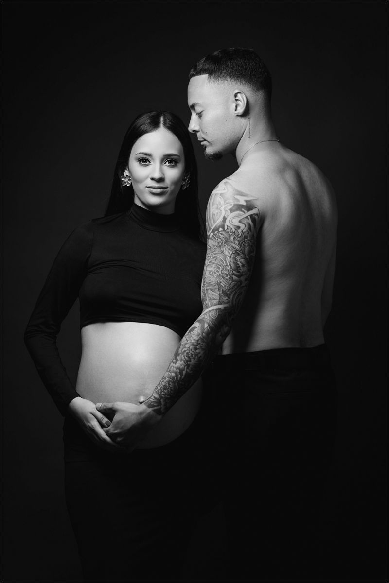 Artistic black and white maternity photo series showing silhouettes and intimate moments during pregnancy.