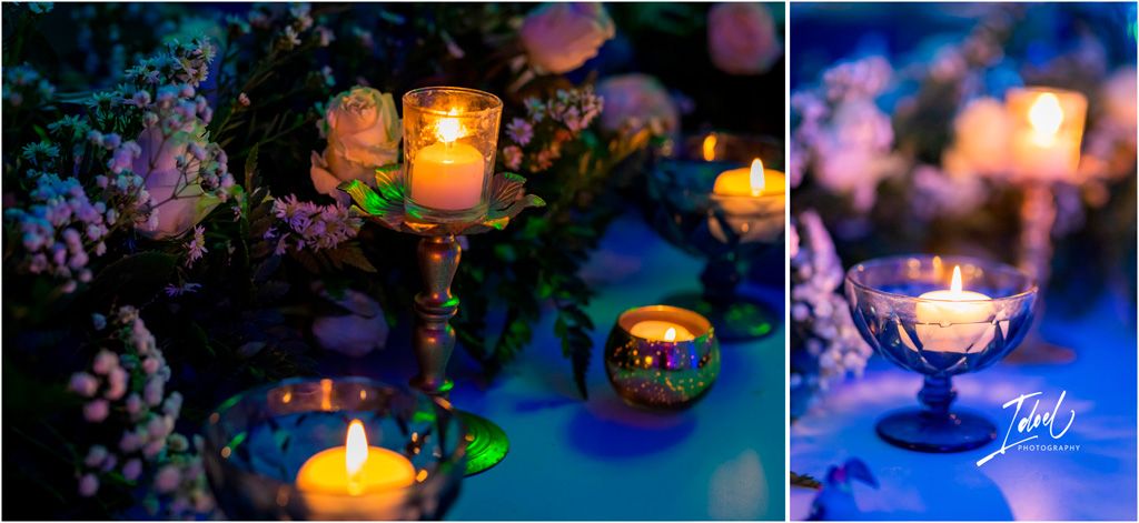 Glowing candlelit lanterns illuminate delicate purple flowers in a dreamy garden setting at dusk.