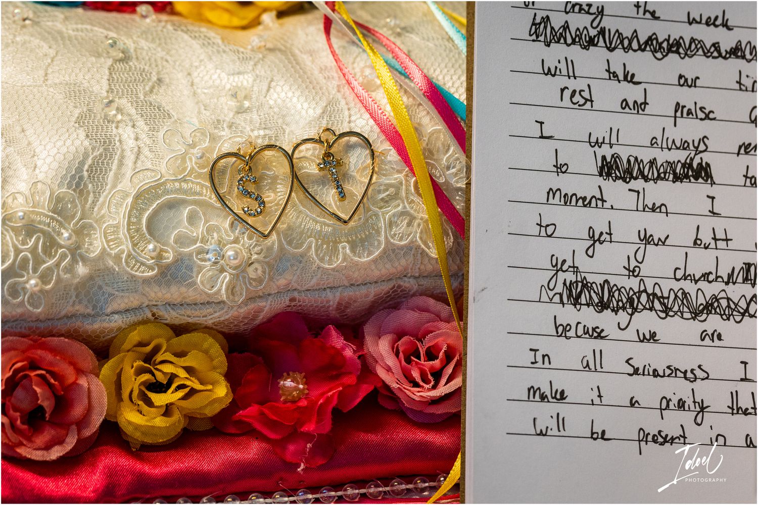 Gold heart decorations and roses next to handwritten notes on white paper.