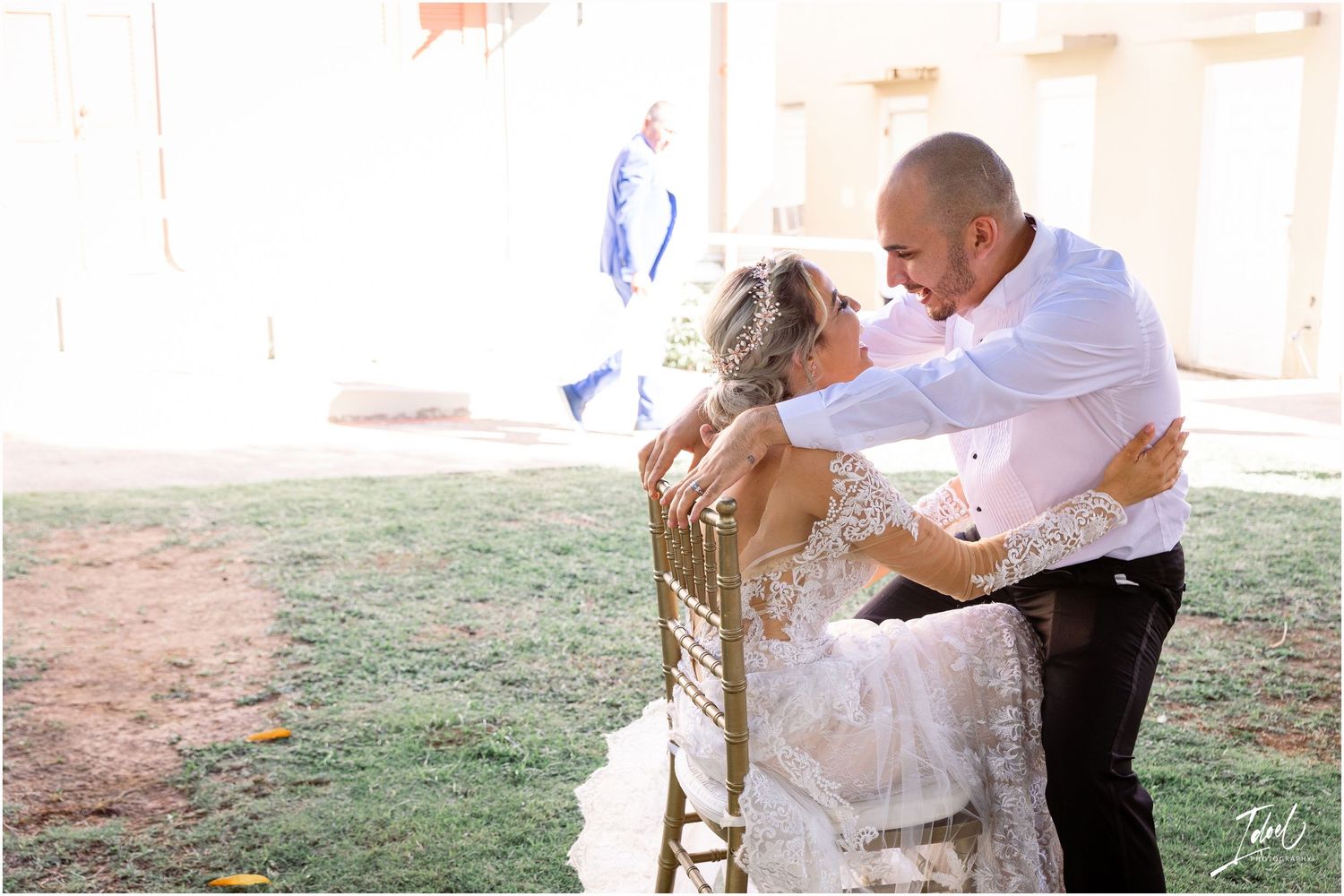 Tender moment captured during outdoor wedding celebration.