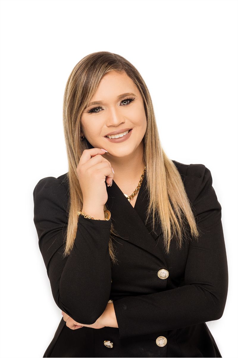 Professional headshot series showing different poses in a black blazer against white background.
