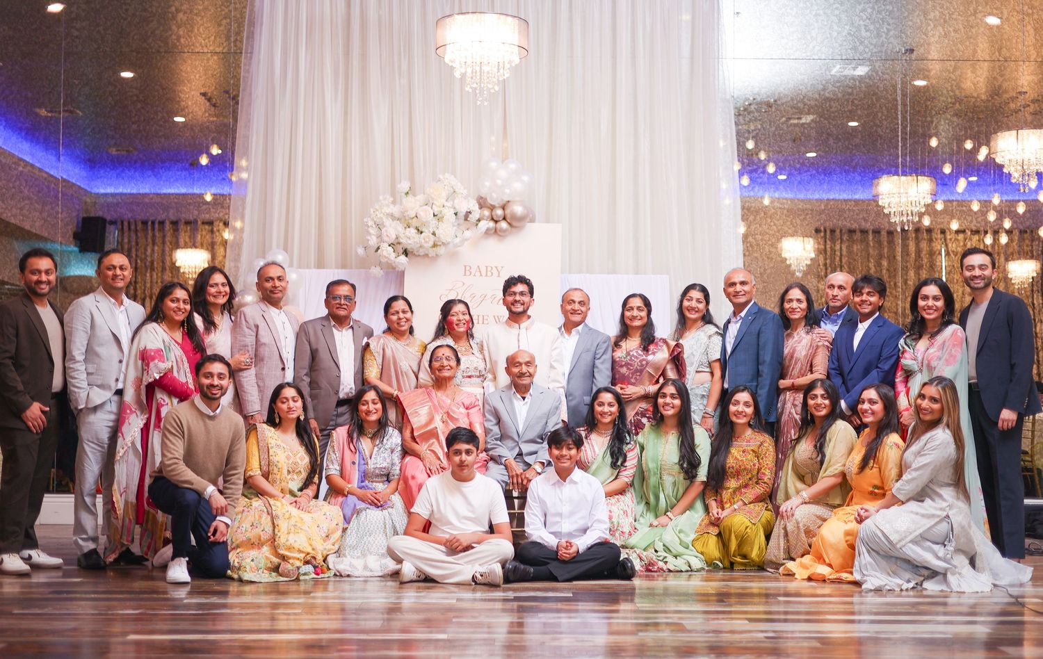 Full family photo captured at a baby shower event by Chehar Lux Studio, preserving joyful family moments.