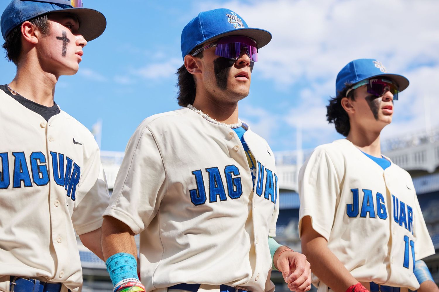 Baseball players in uniform at Yankee Stadium during championship game production