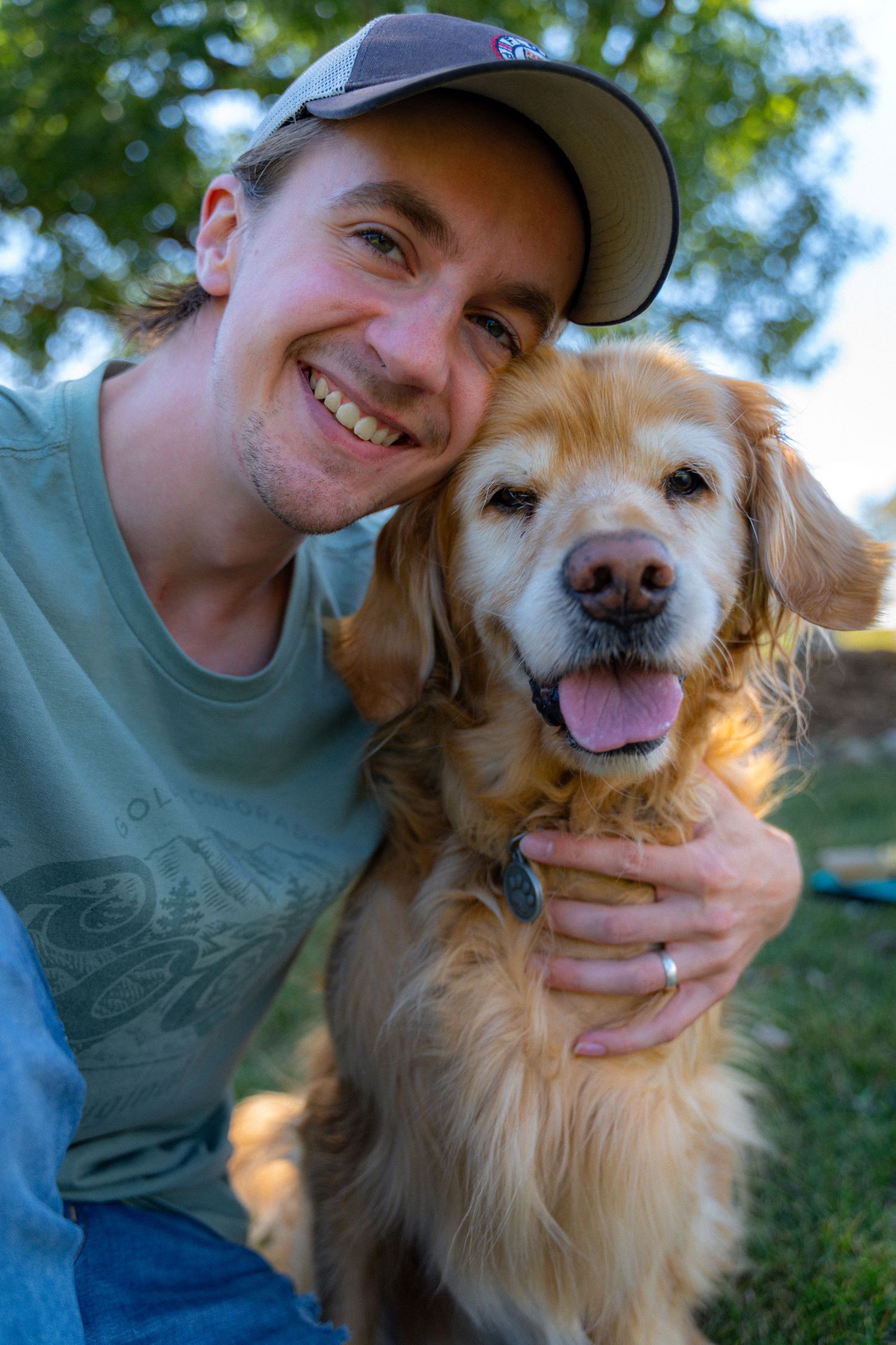 Photographer Breyden Martens posing with his late dog Myah
