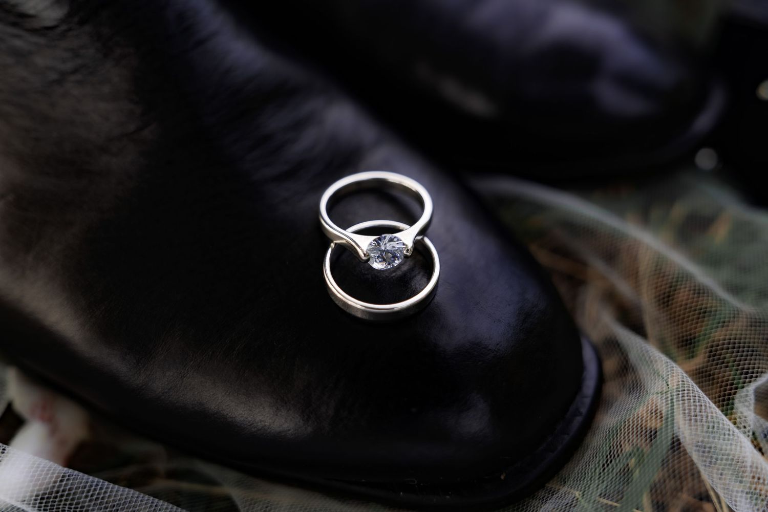 detail wedding ring photo with the groom shoe, photographed by Anny Productions Photography.