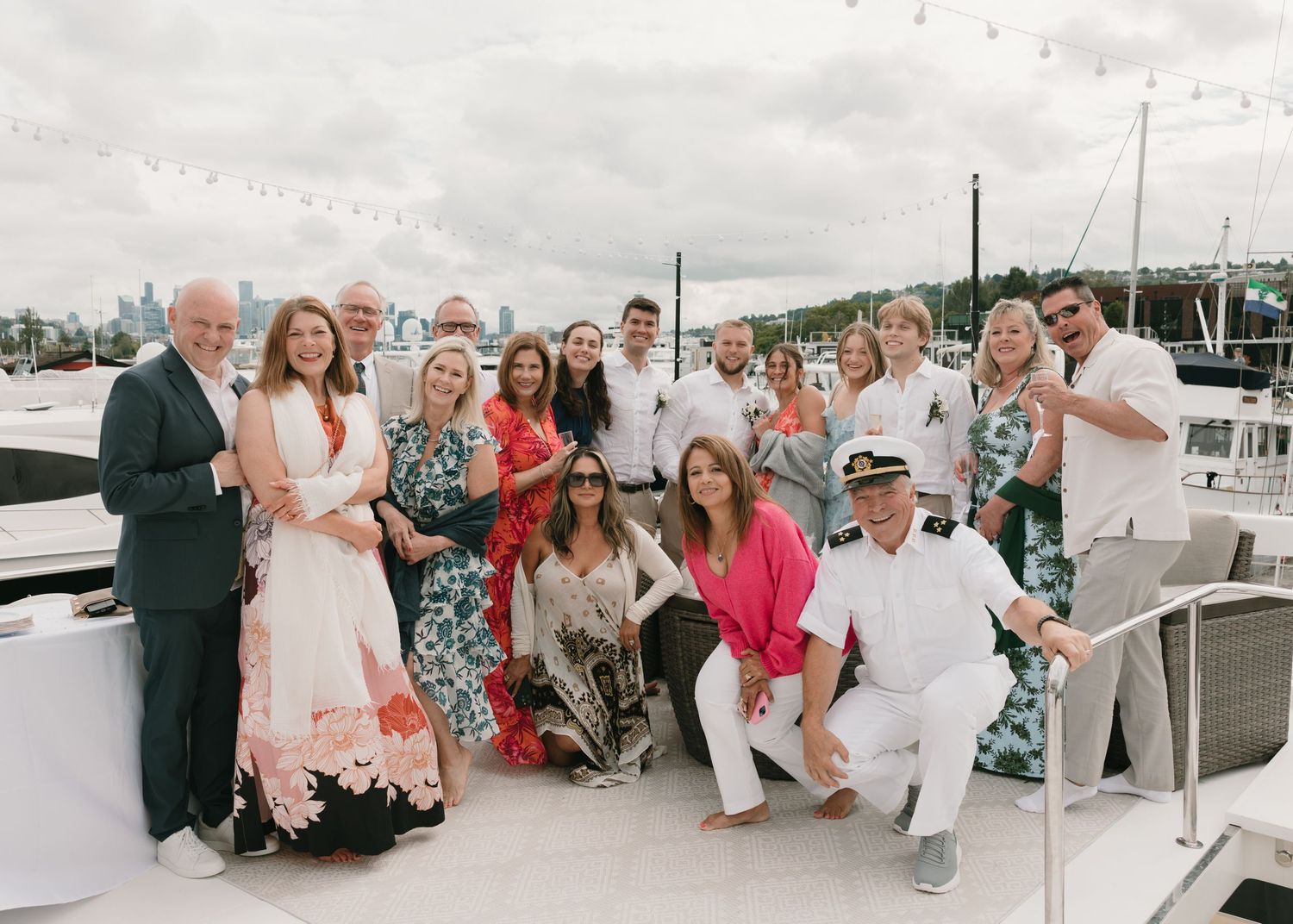 A collage of wedding celebration photos showing guests enjoying an outdoor reception by the water.