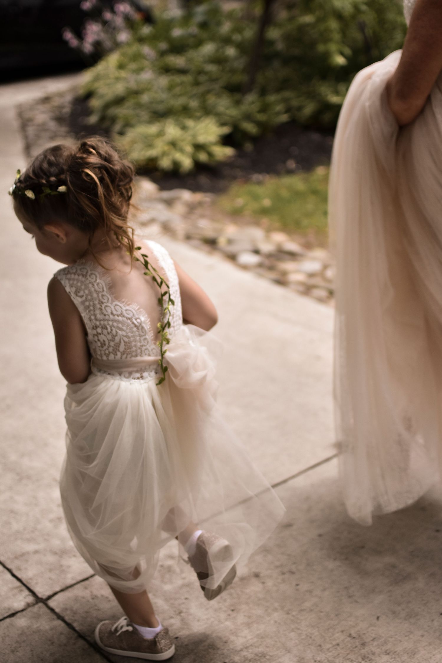 Sentimental moments of the flower girl captured through cinematic photography at this summer wedding in Northern Virginia.