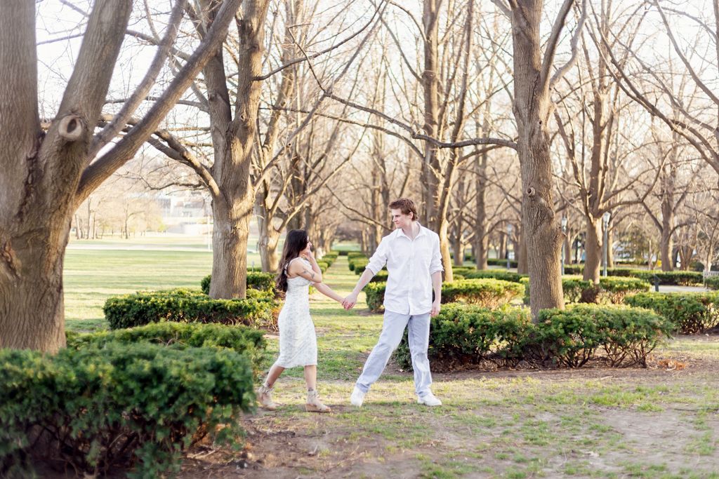 Couple holding hands outside of the  Nelson-Atkins Museum of Art in Missouri