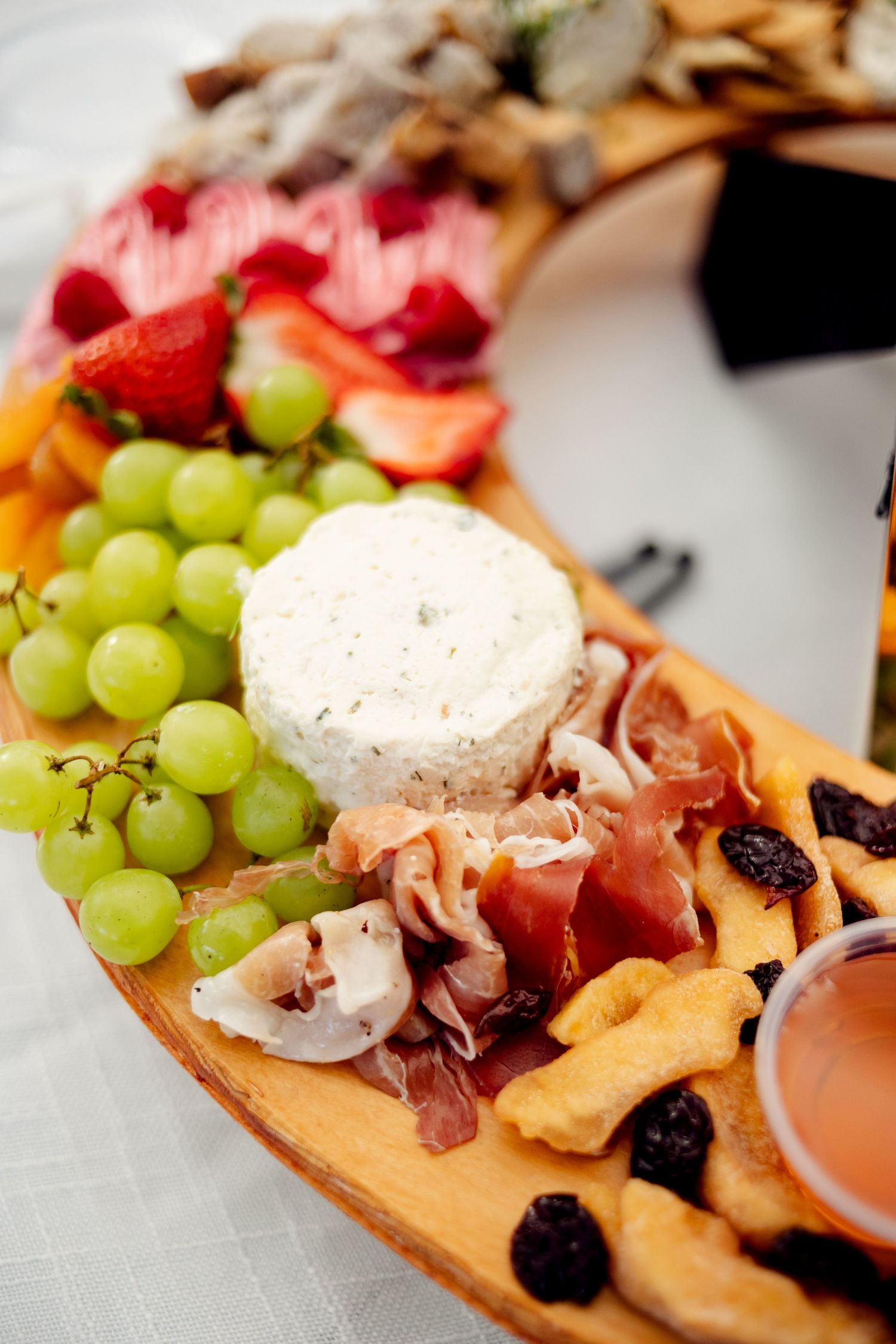 elegant and colorful charcuterie board at table at missouri wedding reception