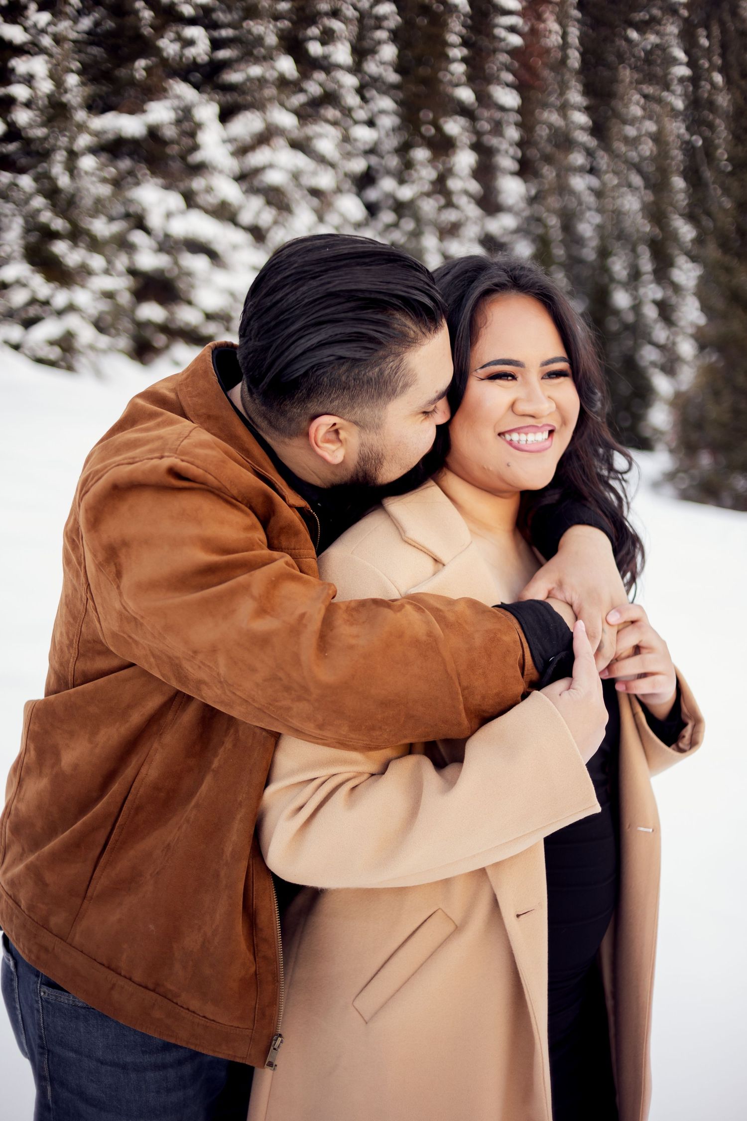 intimate hug between engaged couple in kcmo