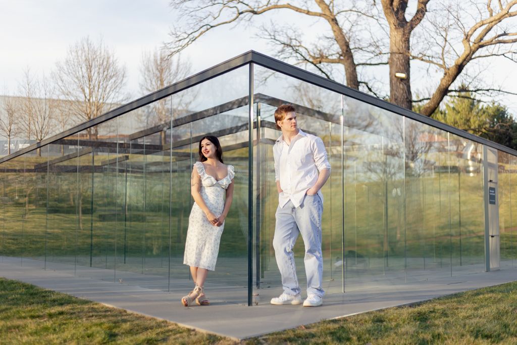 boyfriend and girlfriend leaning on the glass labyrinth at the  Nelson-Atkins Museum of Art in KCMO