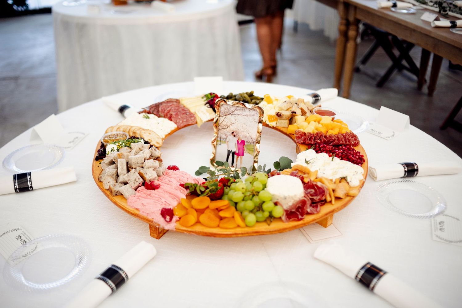 elegant and colorful charcuterie board at table at missouri wedding reception