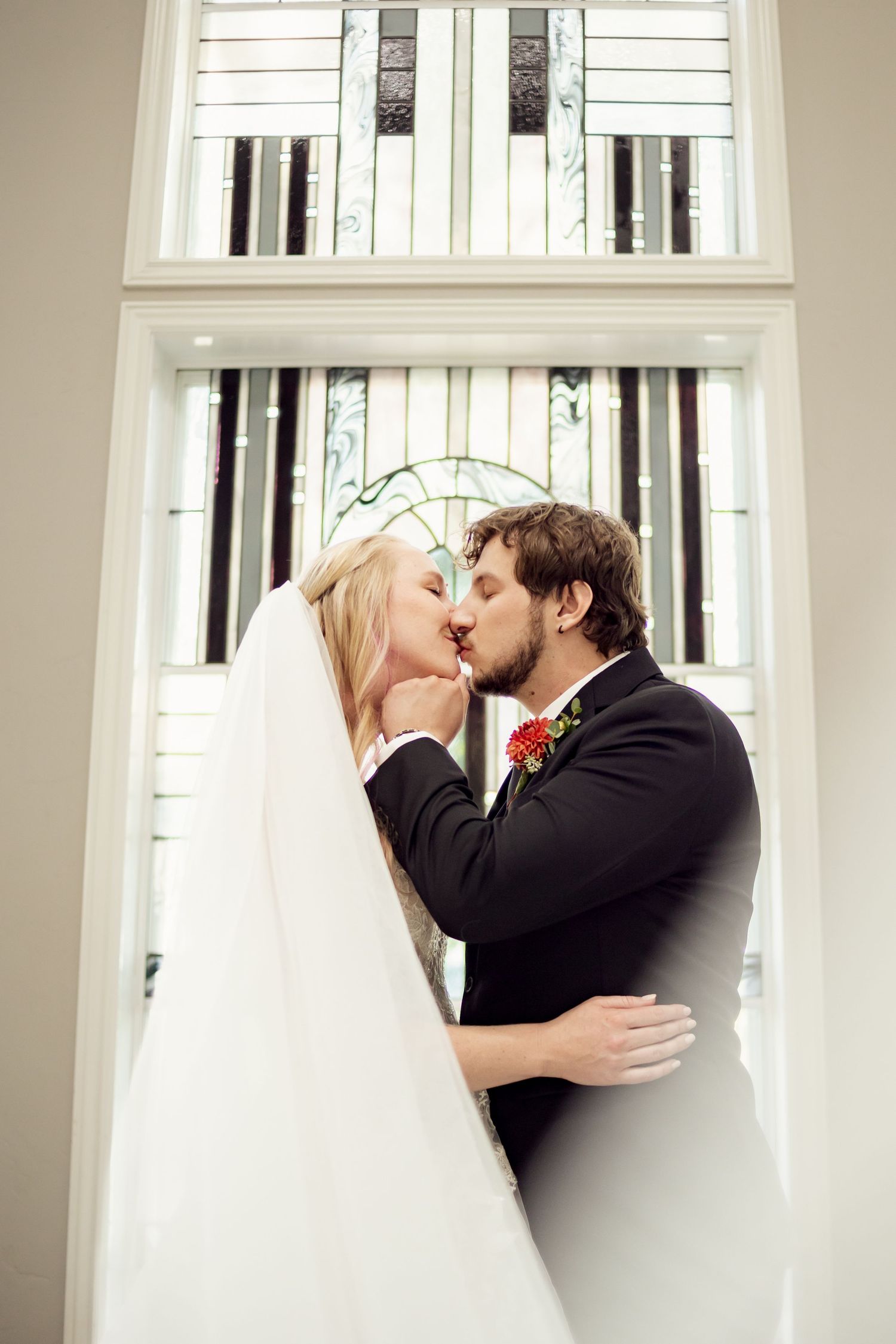 traditional couple kissing at altar in missouri church wedding