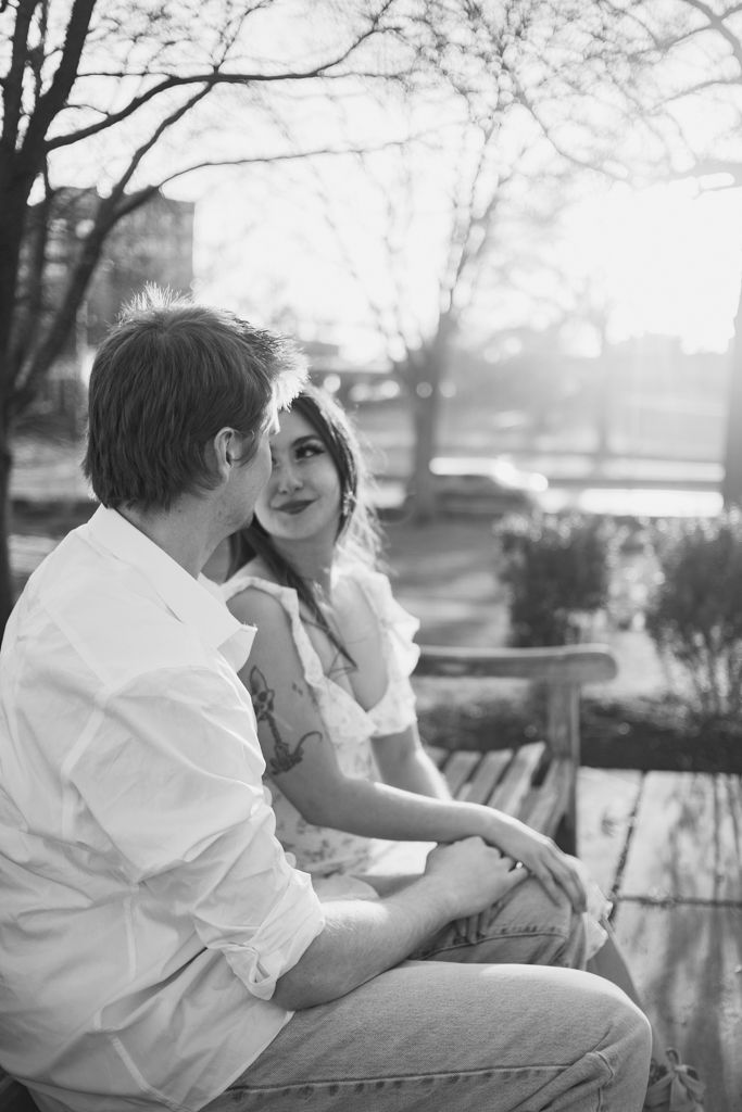 girlfriend looking at her boyfriend on a bench at the  Nelson-Atkins Museum of Art in KCMO