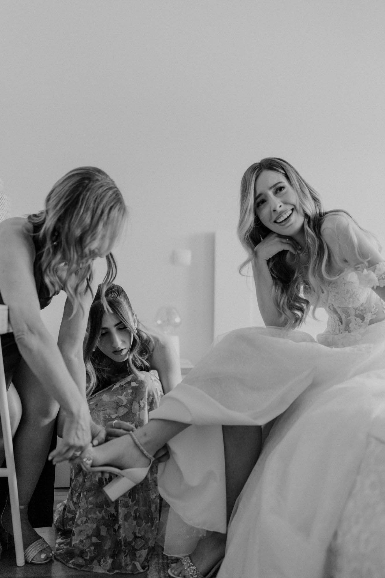 bride getting ready with friends during wedding day in portugal