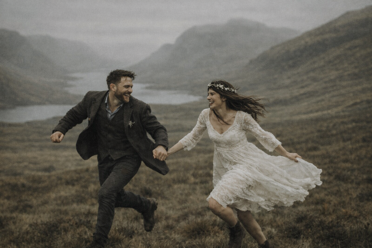 scotland elopement couple running in open landscape