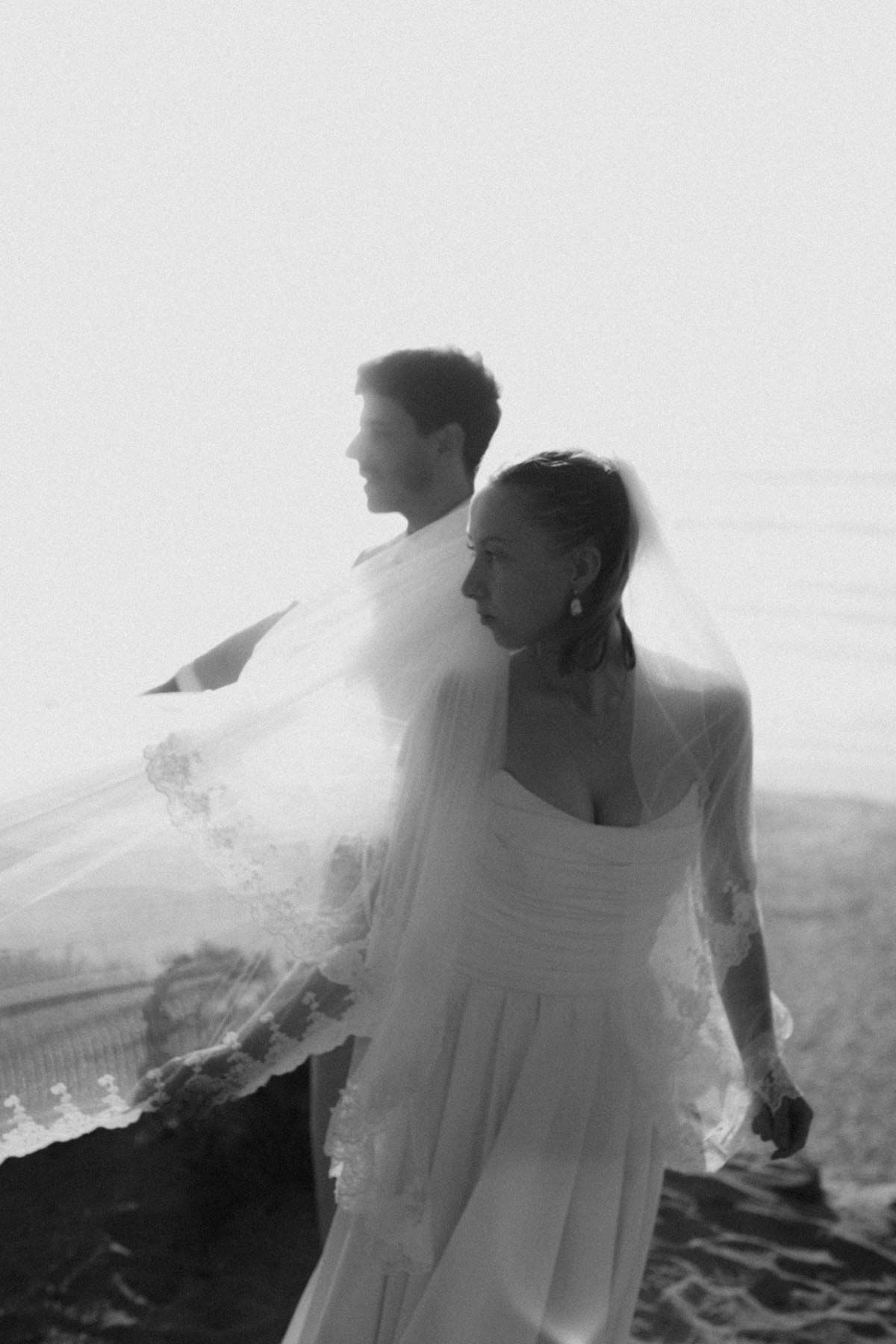 elopement couple walking by the ocean near lisbon portugal