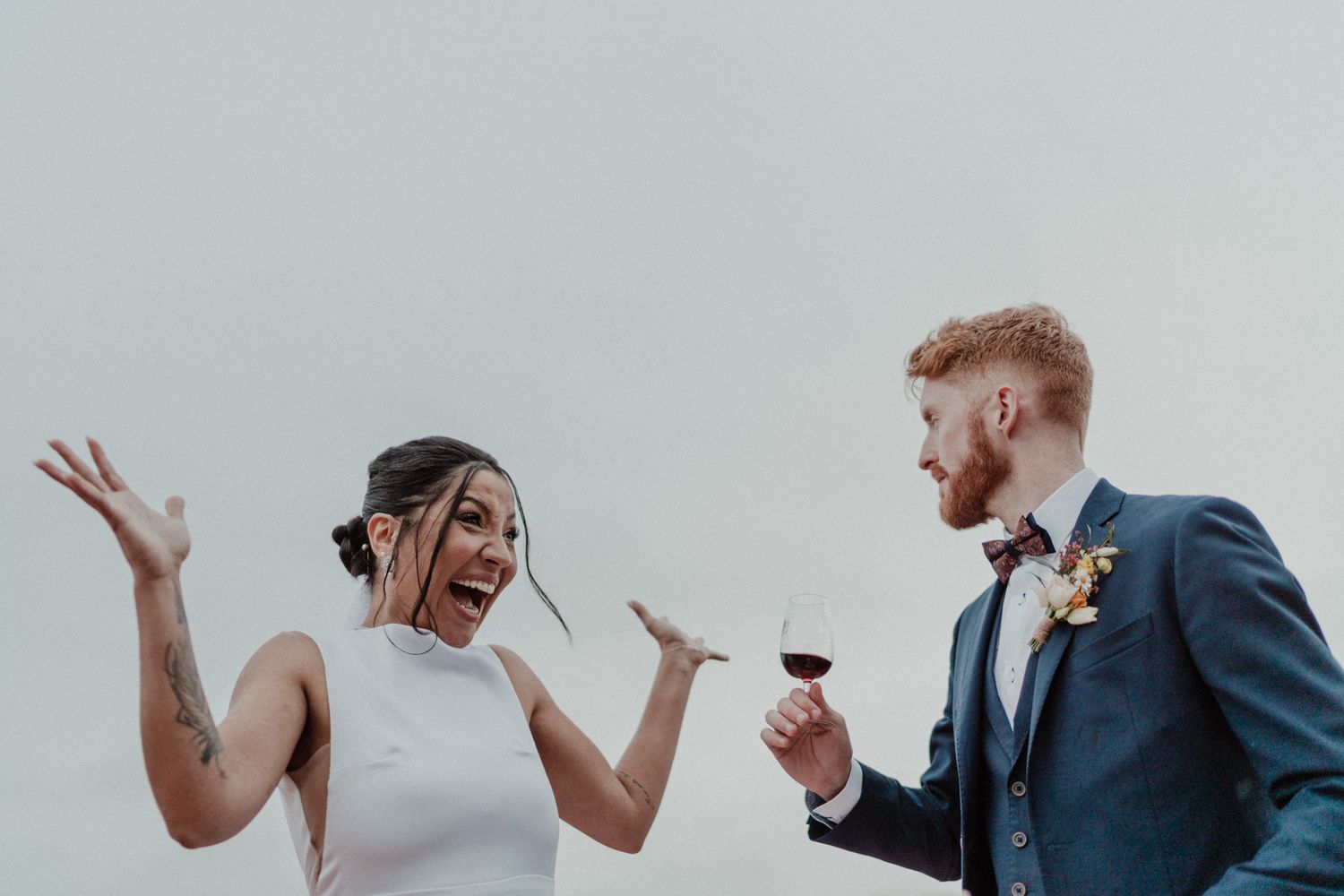Bride and groom celebrating a candid moment during a wedding in Portugal, captured in a documentary and cinematic photography style.