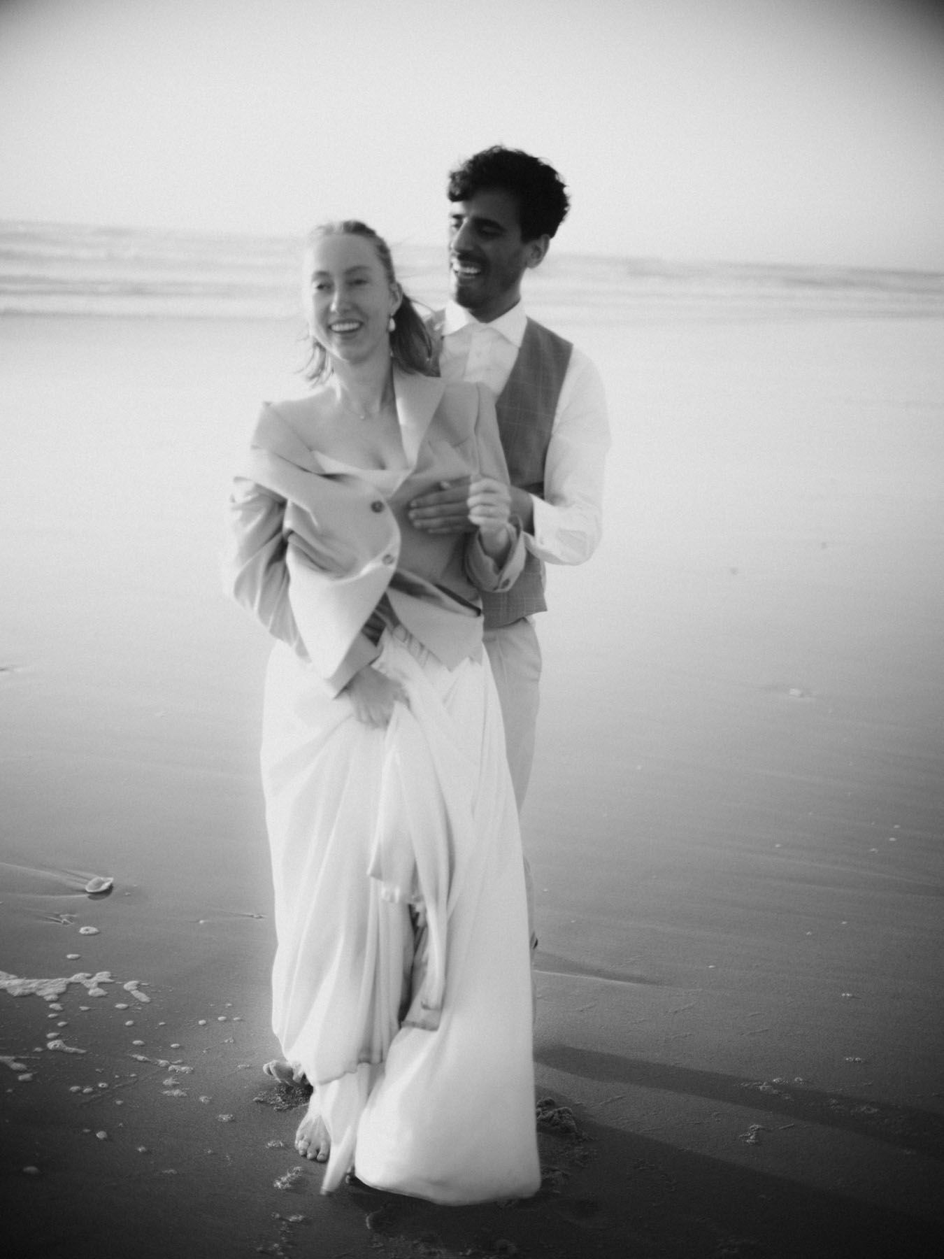 wedding in portugal couple walking on beach