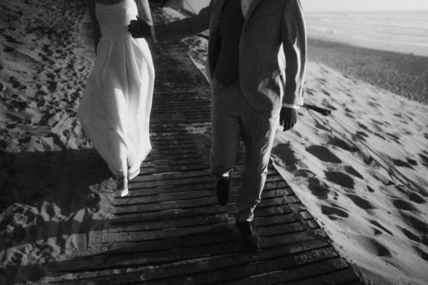 elopement couple walking on the beach near lisbon portugal