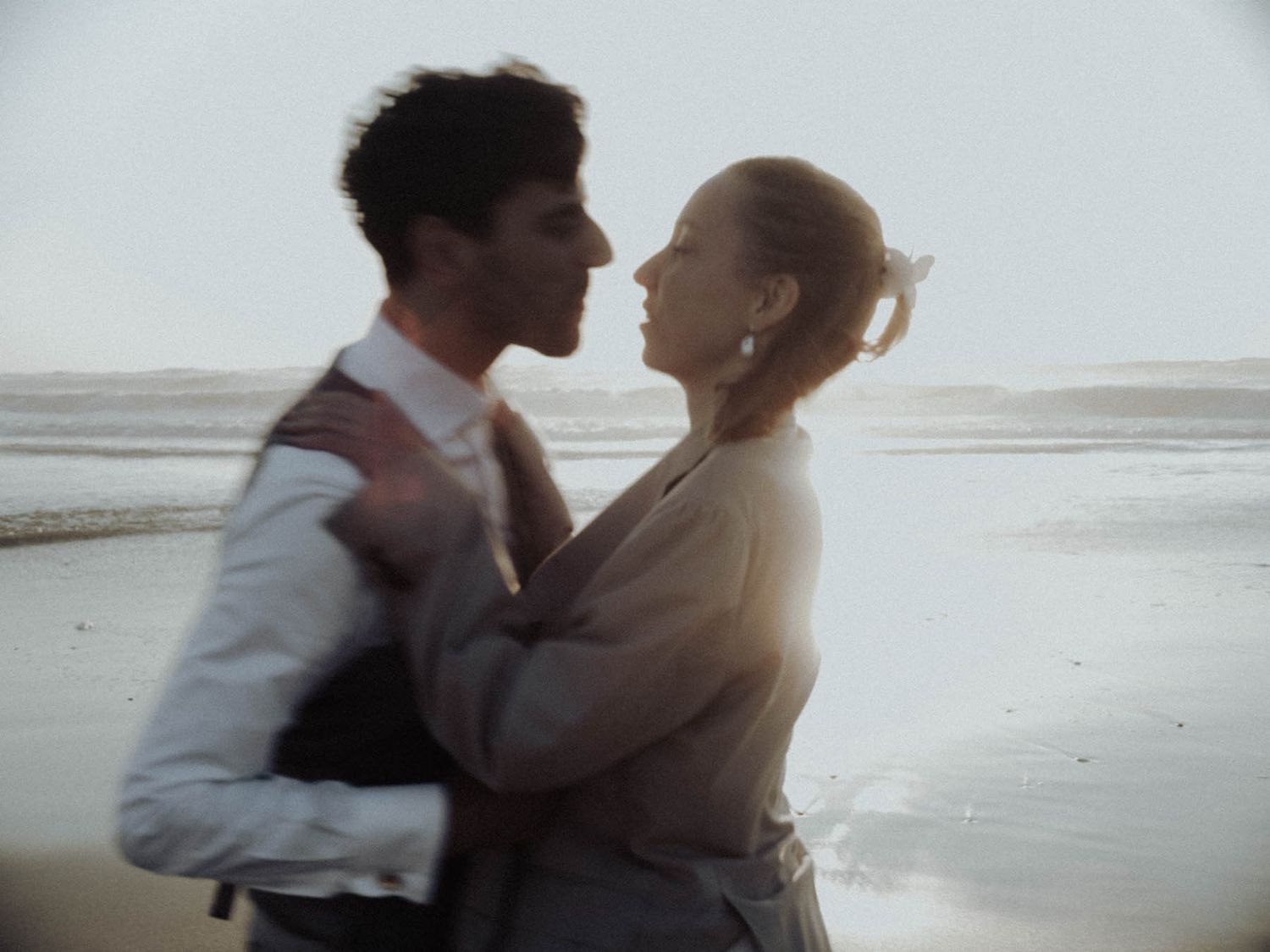 Portugal wedding photographer capturing an intimate elopement moment, couple holding hands in a wild natural landscape