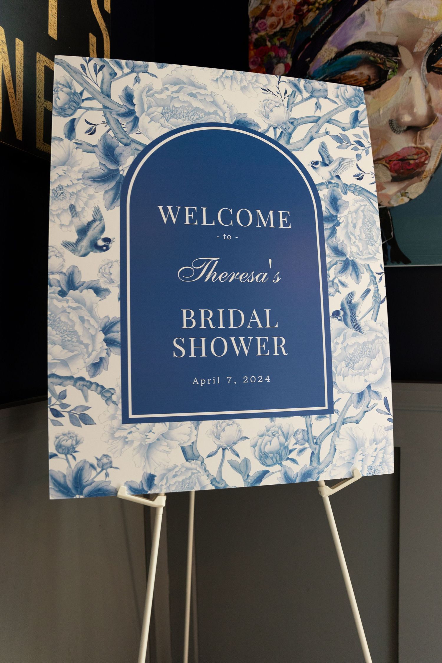 Elegant blue and white floral bridal shower welcome sign for Theresa, April 7 2024.