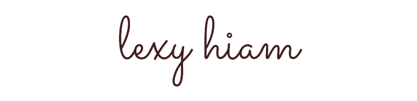 Photographer Lexy Hiam's signature in elegant cursive script in dark burgundy on a white background.