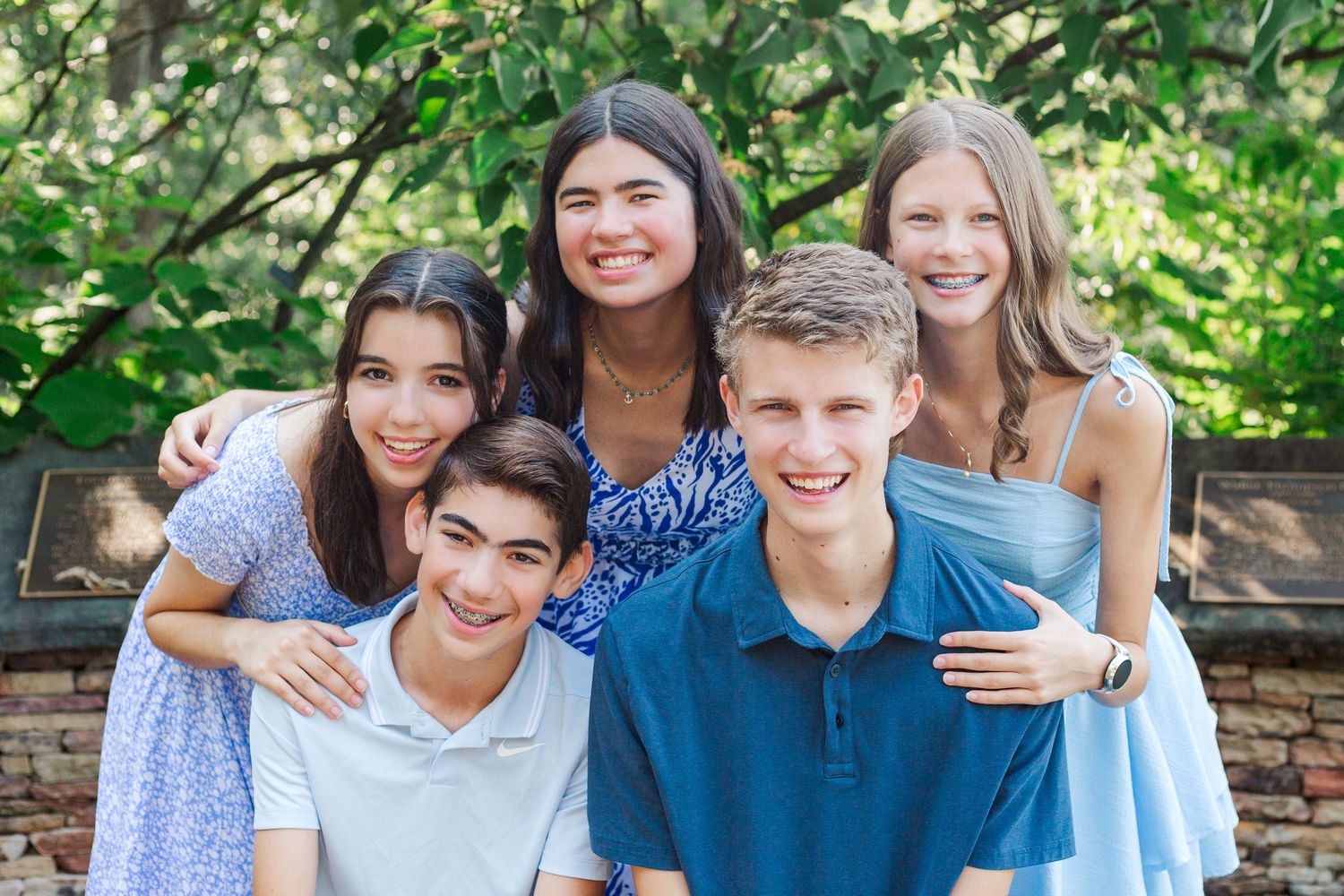 A group of high school seniors sitting together at the Botanical Gardens in Clemson, SC
