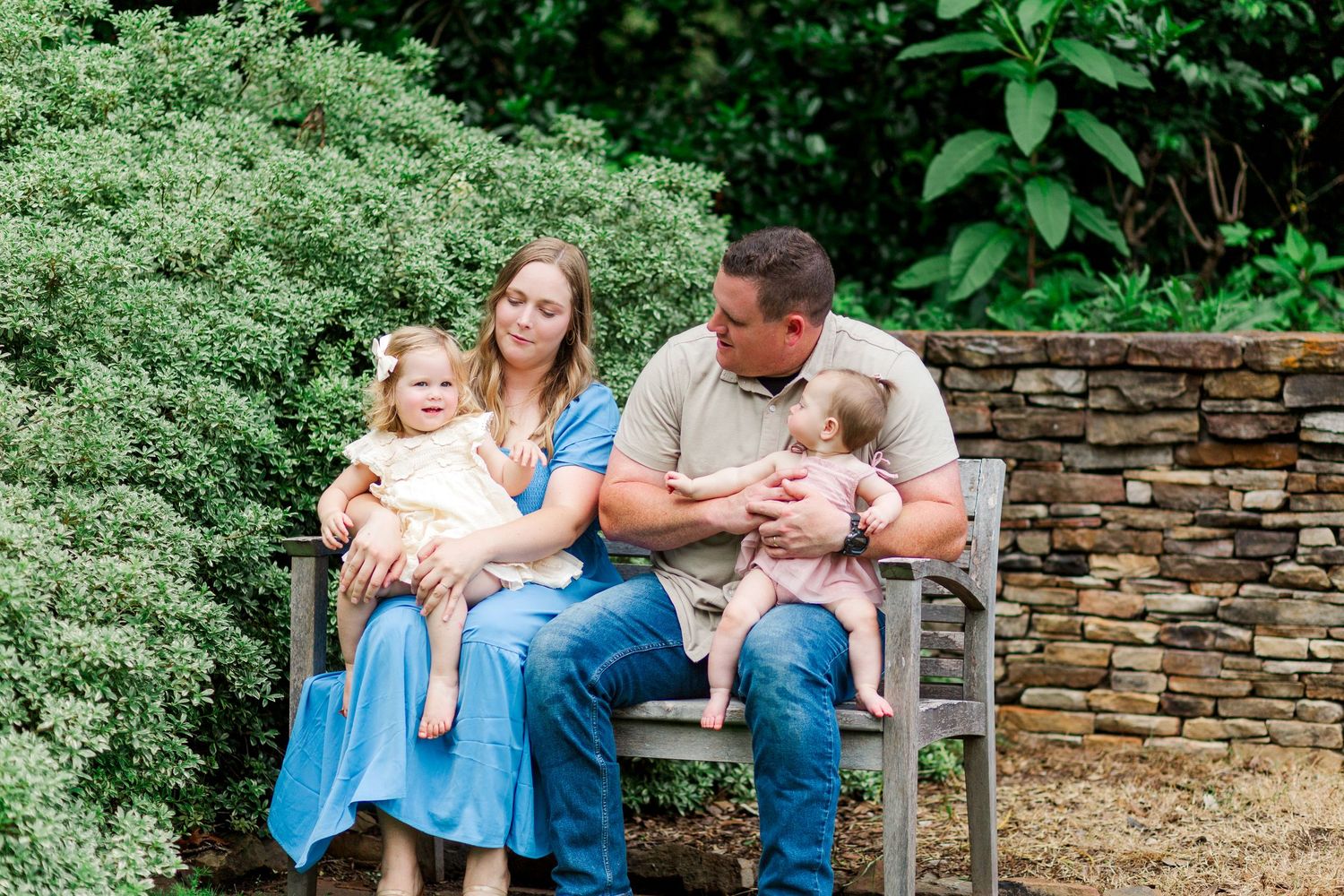Family enjoys a playful moment together at a family photo session in Clemson, SC