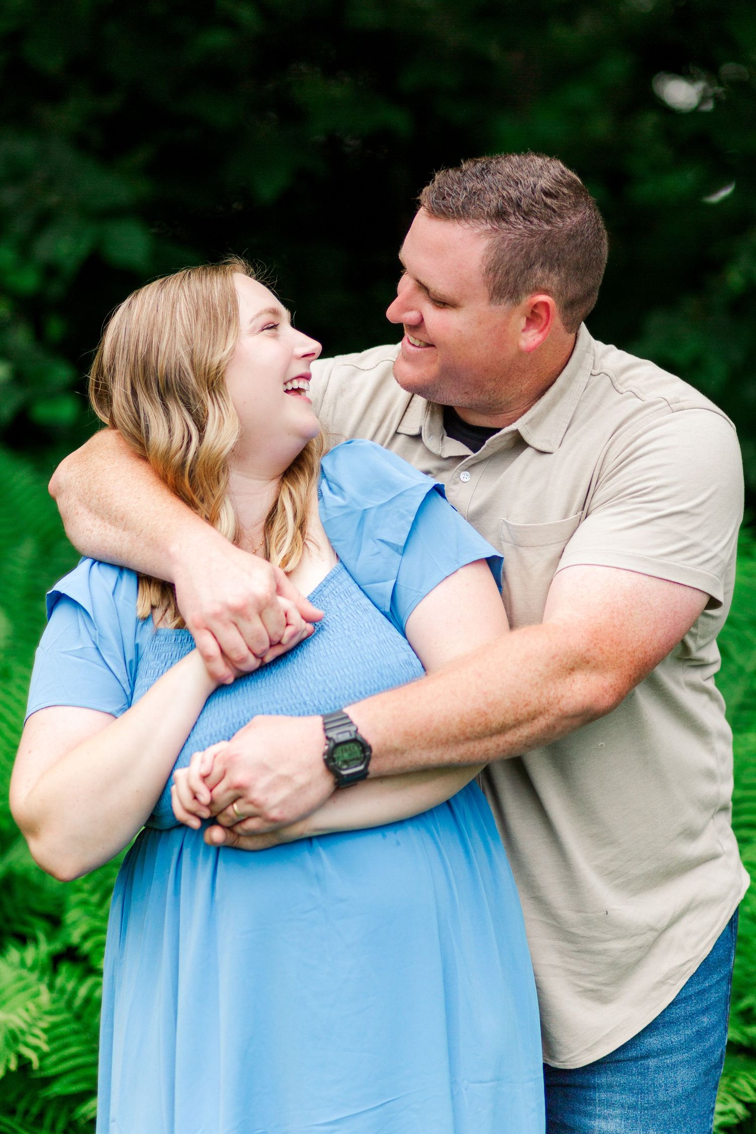A couple embraces lovingly for family photos in Clemson, SC