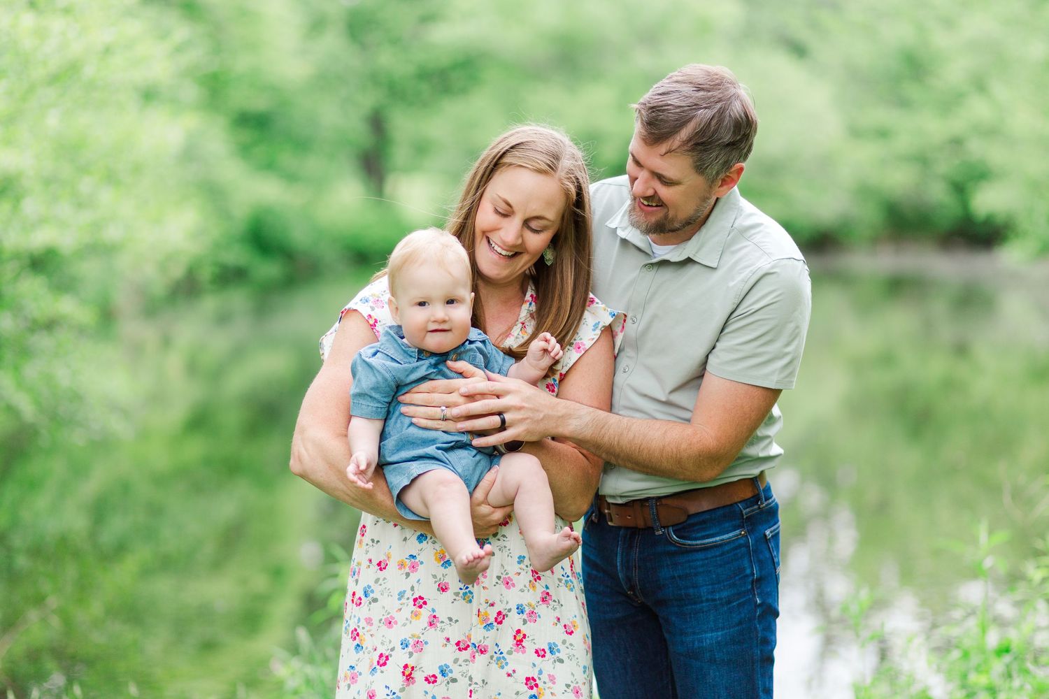 A loving family shares joyful moments together for a spring family photo session in Hendersonville, NC taken by a Clemson, SC photographer