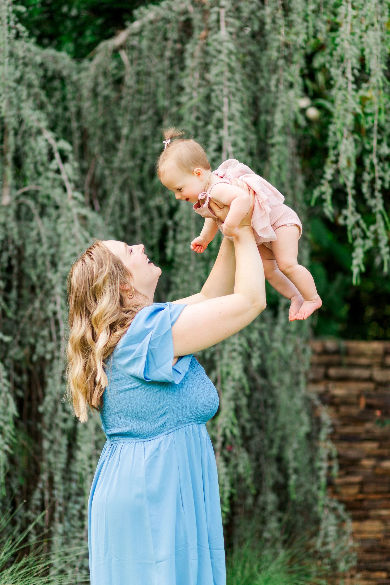 A series of photos showing joyful moments in Clemson, SC between parent and baby outdoors for their family photo session.