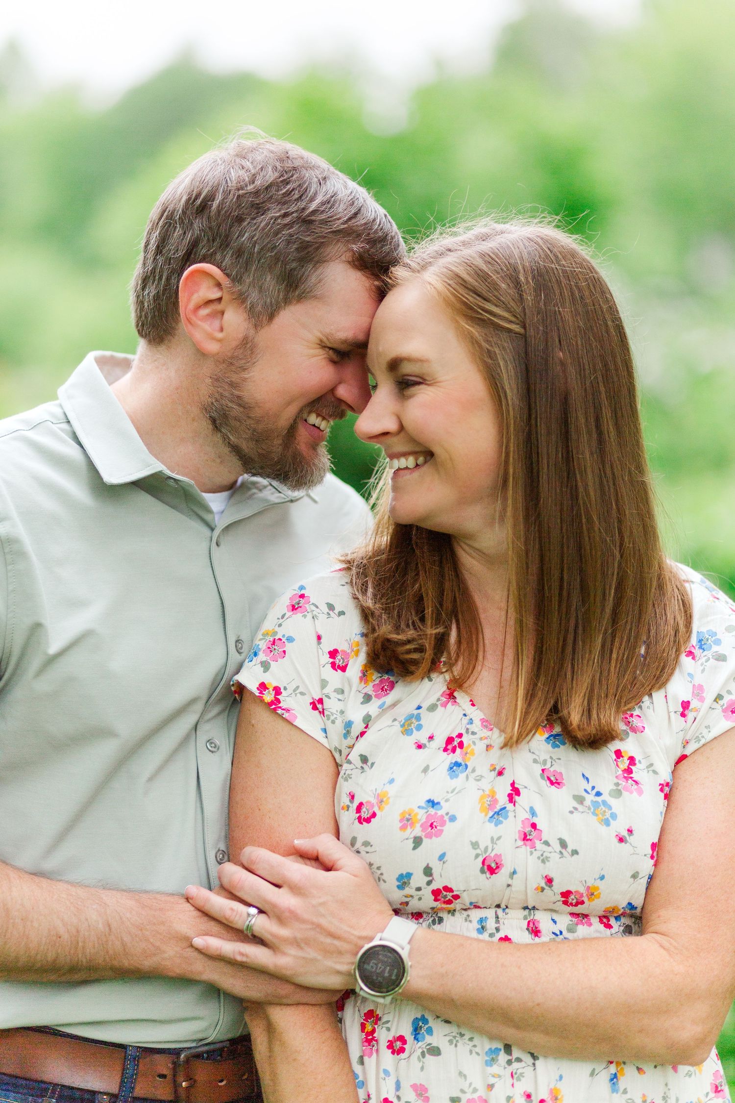 Sweet candid moments shared between couple for a family session in Hendersonville, NC taken by a Clemson, SC photographer