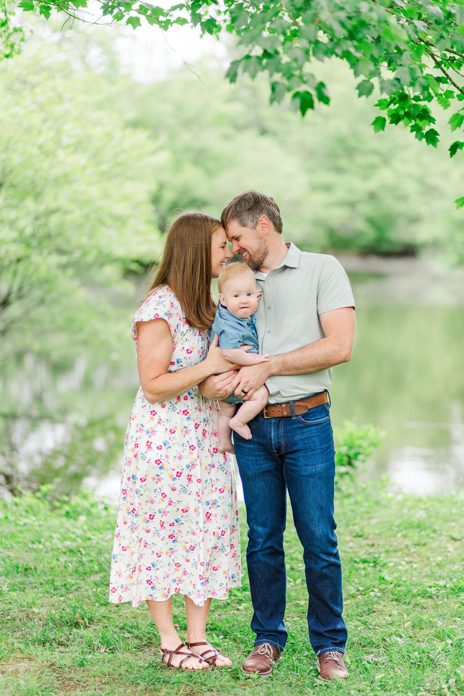 Family shares tender moments together for a photo session taken by a Clemson photographer in Hendersonville, NC.