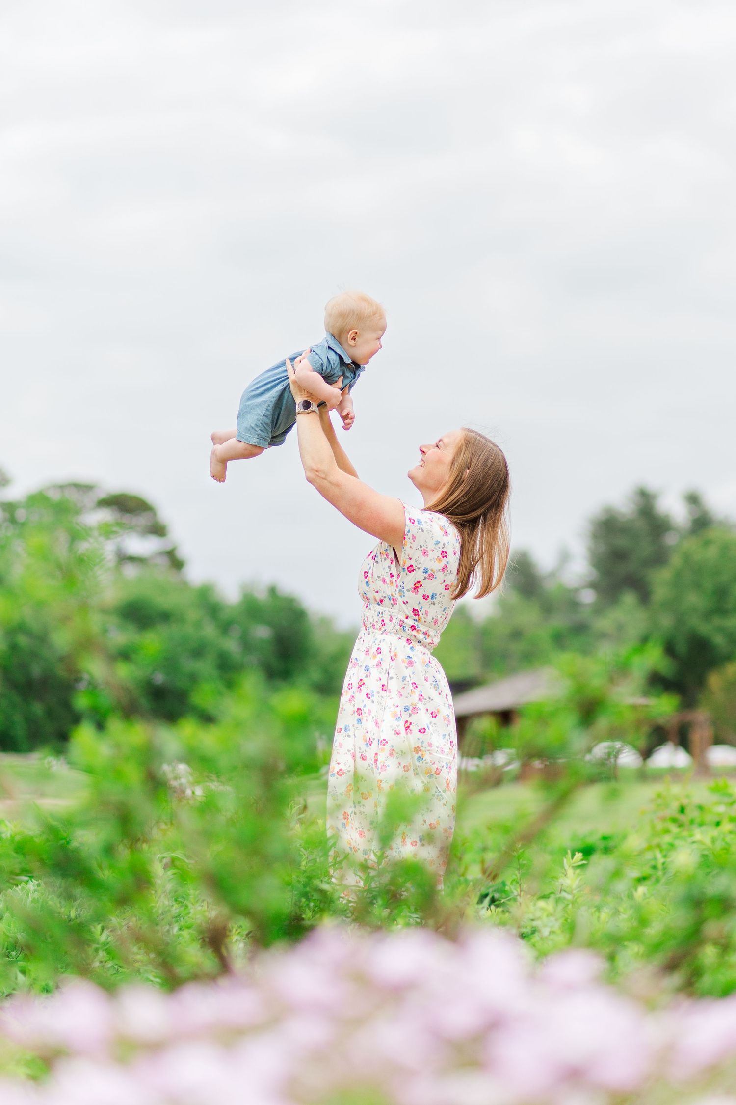 Joyful moments captured in dreamy outdoor setting with spring flowers in Hendersonville, NC taken by a Clemson, SC photographer