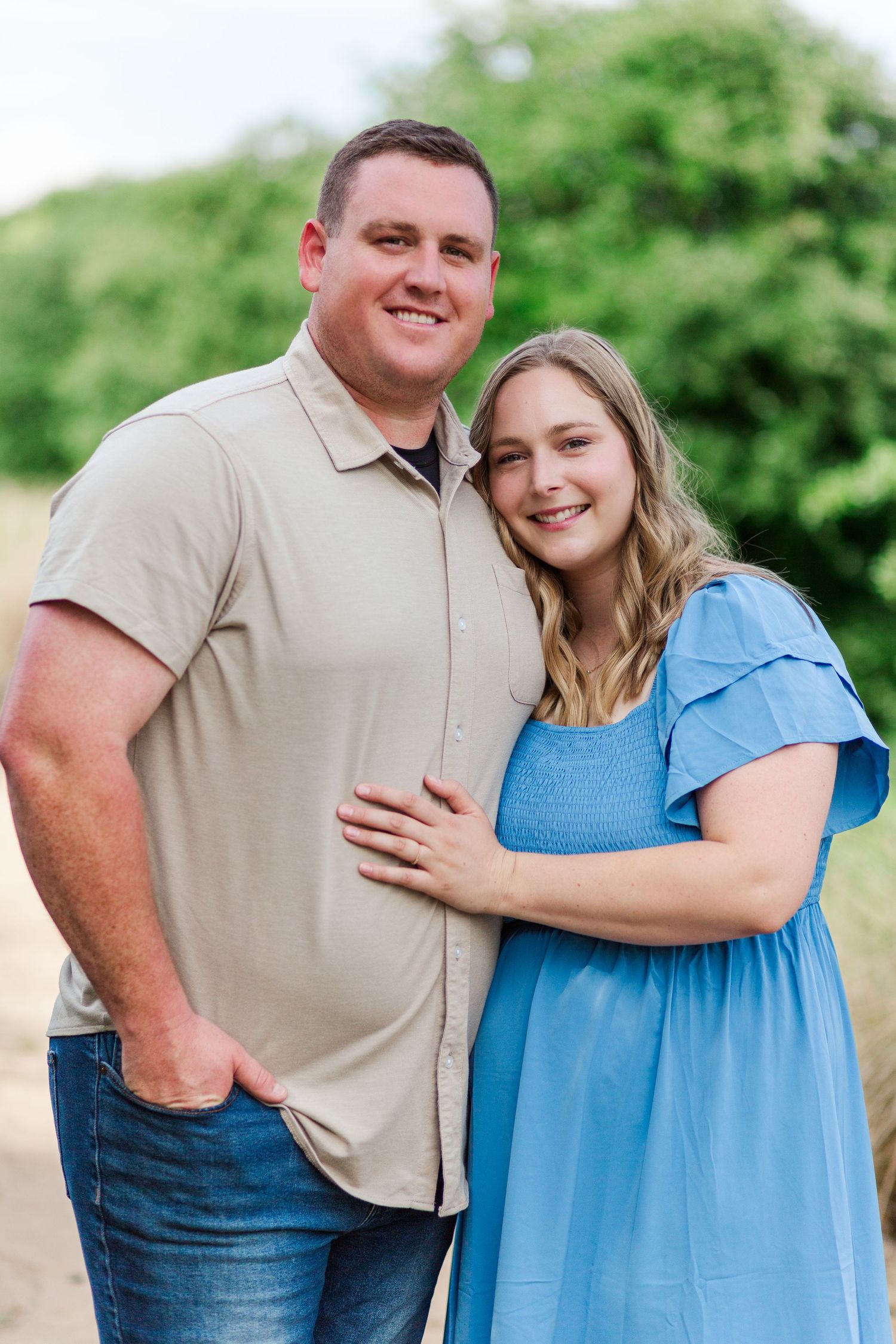 Clemson, SC family photo session in tall grass with couple at the Botanical Gardens.