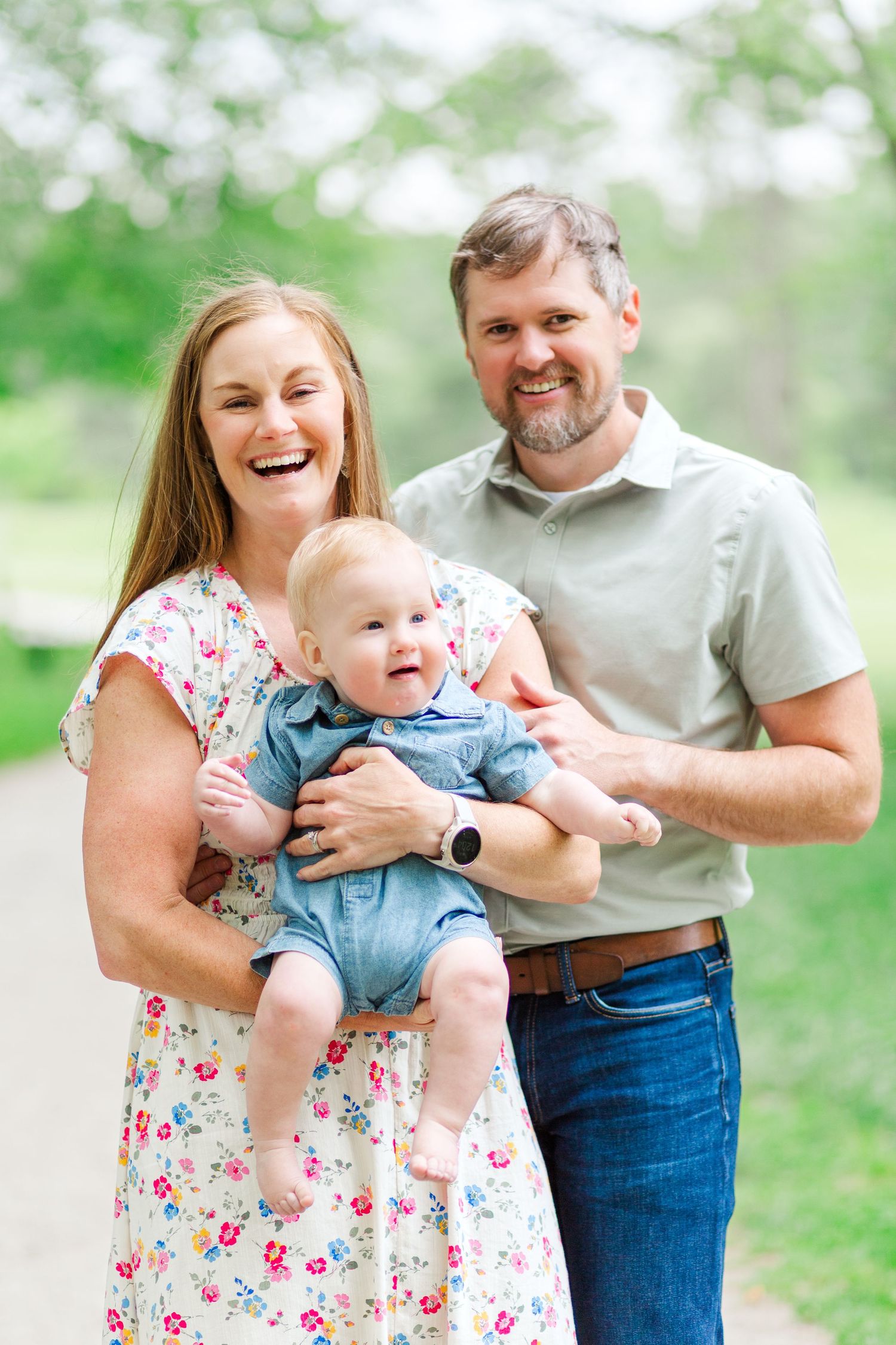 A family shares joyful moments together outdoors in a series of candid shots for a photo session in Hendersonville, NC.