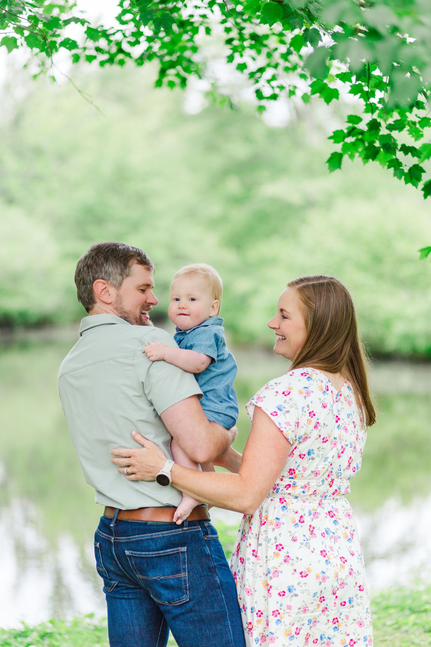 Family shares tender moments together for a photo session in Hendersonville, NC taken by a Clemson, SC photographer