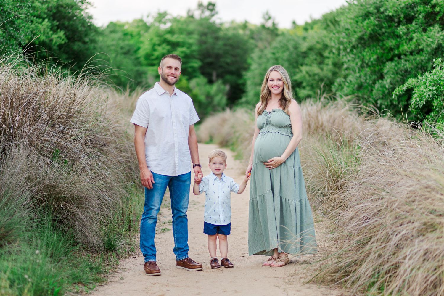 Family in Clemson, SC walking along a rustic path through lush green foliage in multiple connected outdoor portrait scenes.